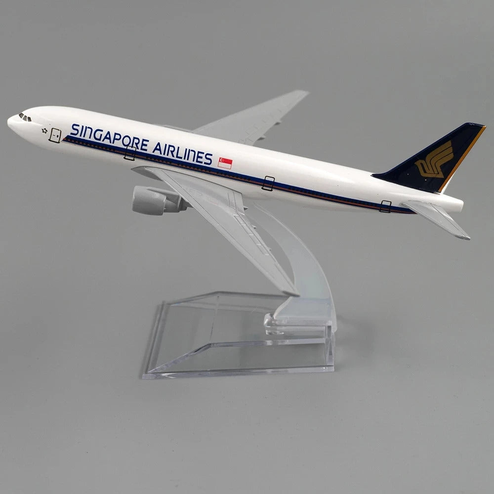 Model airplane of Singapore Airlines on a clear stand against a gray background