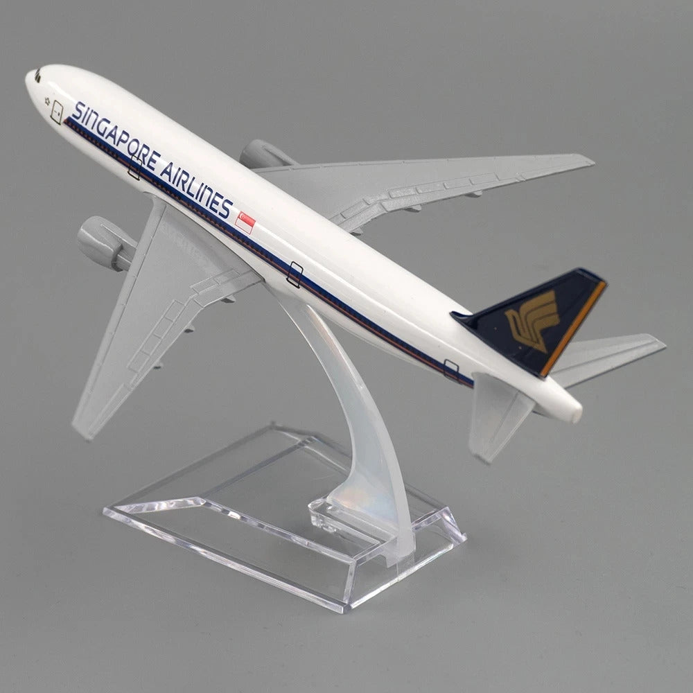 Model airplane of Singapore Airlines on a clear stand against a gray background
