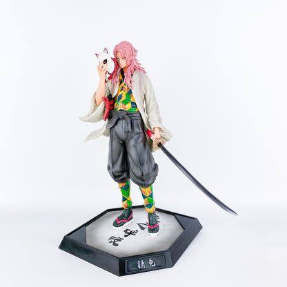 Sabito Demon Slayer action figure 27 cm, with long pink hair, holding his fox mask and sword, wearing a patterned kimono. High-quality PVC statue on a hexagonal base.
