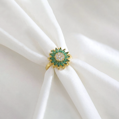 Solis emerald green anti-tarnish sunflower ring wrapped around folded white silk