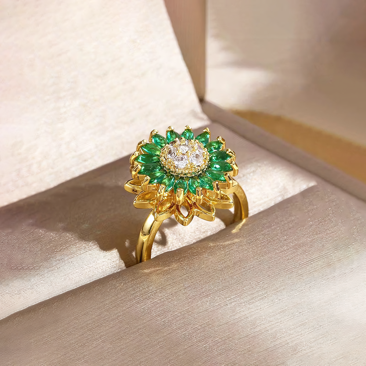 Solis emerald green anti-tarnish sunflower ring wrapped around folded white silk
