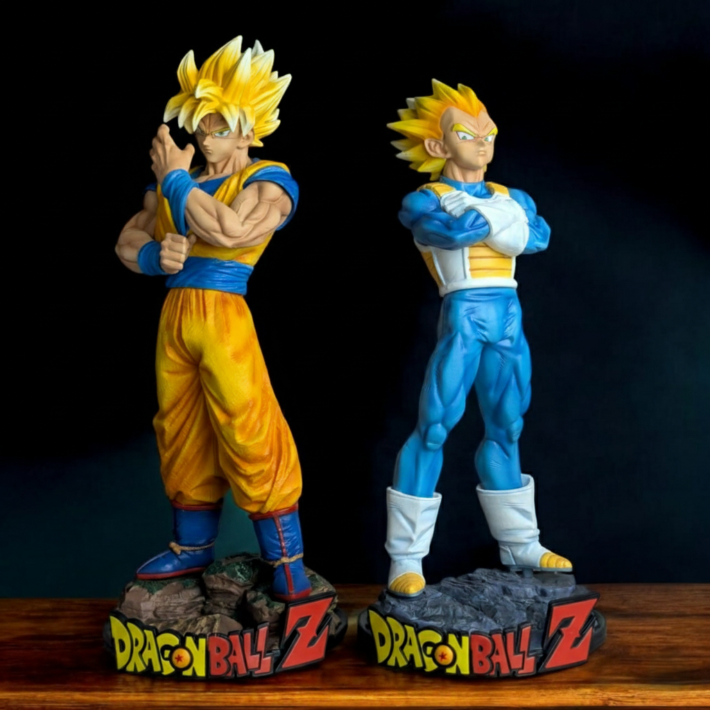 Set of 2 Dragon Ball Z Super Saiyan Goku and Super Saiyan Vegeta standing figures, 30-32.5 cm tall, on rocky bases with the DBZ logo. High-quality collectible statue set.