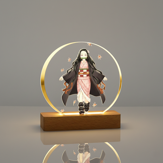 Nezuko Kamado LED night lamp featuring a colorful image of the Demon Slayer character on a circular acrylic panel, glowing with a warm golden light from a rectangular wooden base, set on a dark wooden table.