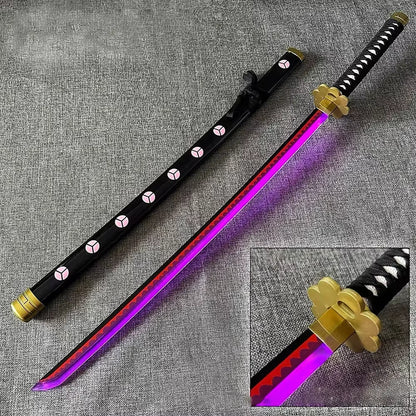 Roronoa Zoro Shusui Katana replica 104 cm, wooden sword with black scabbard and purple LED illuminated blade, shown with gold tsuba detail. Safe, non-sharp prop.