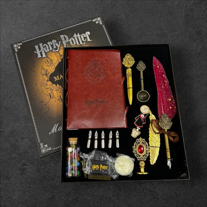 Harry Potter Collector's Gift Set box including a red Hogwarts journal, vintage quill dipping pen, wax seal stamp, melting spoon, wax beads, and feather bookmark.