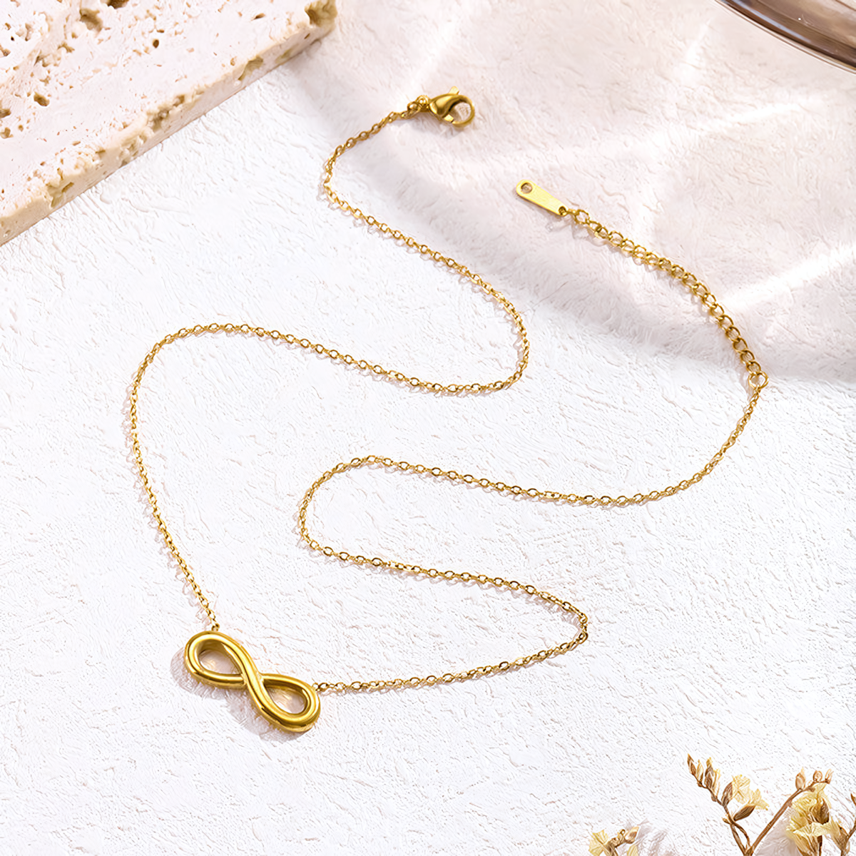 Full length view of the Aura gold anti-tarnish infinity necklace showing the adjustable lobster clasp