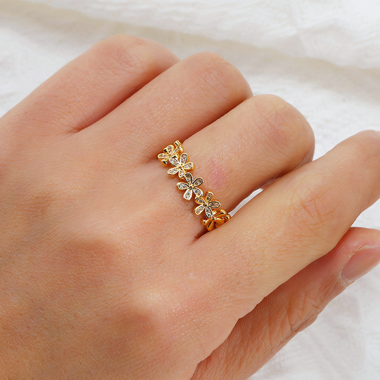 Model wearing the Fleur anti-tarnish gold floral ring showing the adjustable fit on the finger