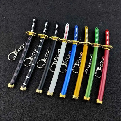Mini katana keychain 15 cm, detailed sword replica accessory. Assorted colors, randomly selected. Durable metal alloy.