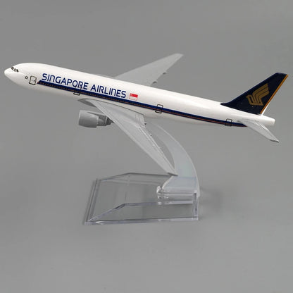 Model airplane of Singapore Airlines on a clear stand against a gray background
