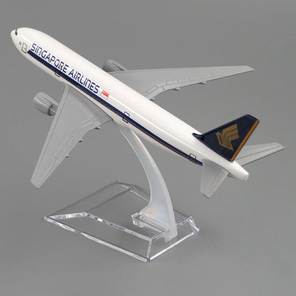 Model airplane of Singapore Airlines on a clear stand against a gray background