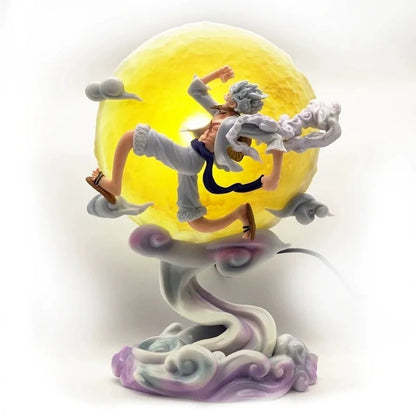 One Piece Luffy Gear 5 Sun God Nika figure 25 cm, leaping in front of a glowing yellow LED moon/sun on a swirling cloud base. High-detail anime statue.