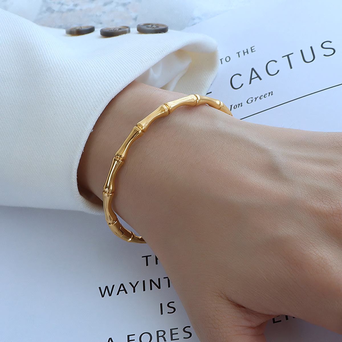 Close up of the Mila gold anti-tarnish bamboo joint bracelet worn on a wrist